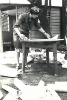 Basic conservation in the early days! Norah Gurney, Archivist, cleaning glebe terriers in the Borthwick garden, 1960s